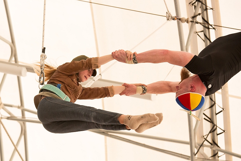 Carolyn Randles, as Amelia Earhart in the 2015 summer Fly Show, is caught by Tom Hanna.