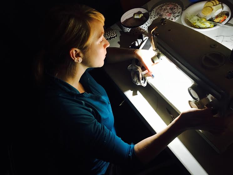 Coach Milla putting finishing touches on costumes