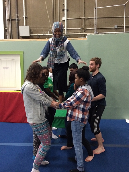 Ian Jagel works with a group of teens from Refugee Women's Alliance (ReWA).